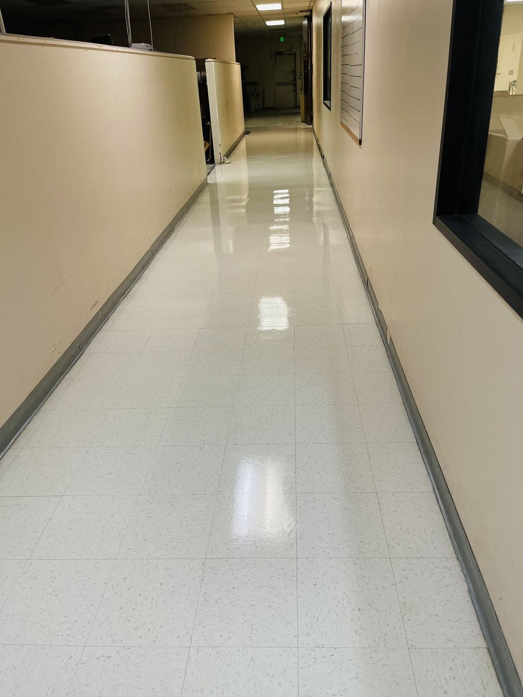 Freshly stripped and waxed commercial hallway floor