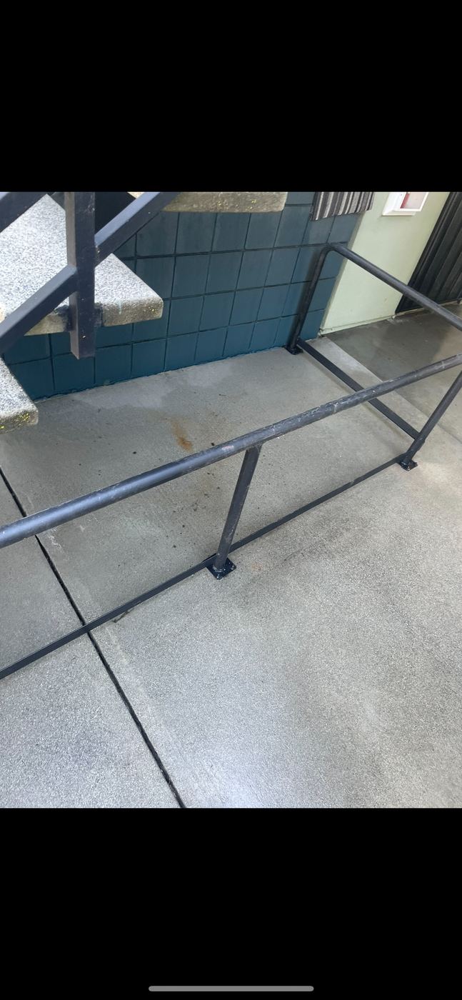 Clean stair landing after pressure washing